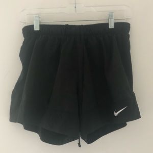Black Nike athletic running shorts